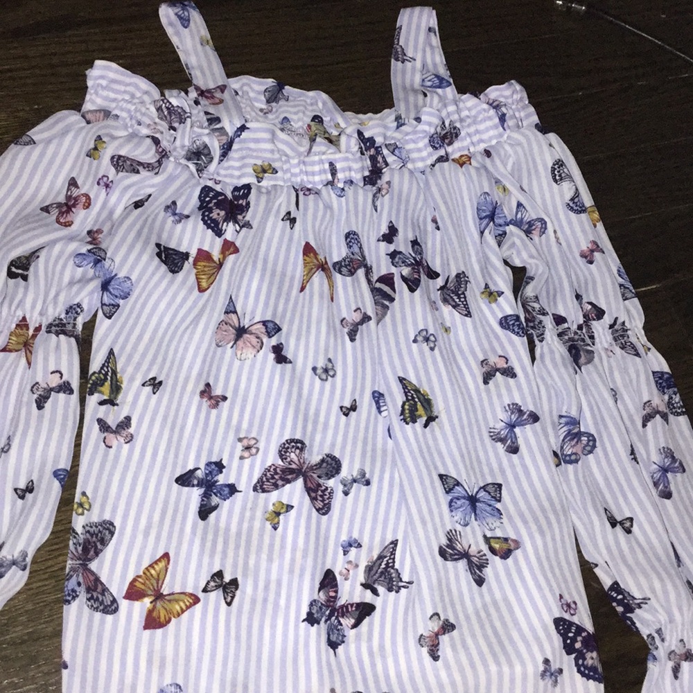 A butterfly themed blouse